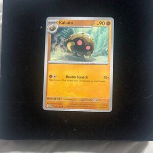 Pokemon Kabuto Card with Orange and Yellow Accents